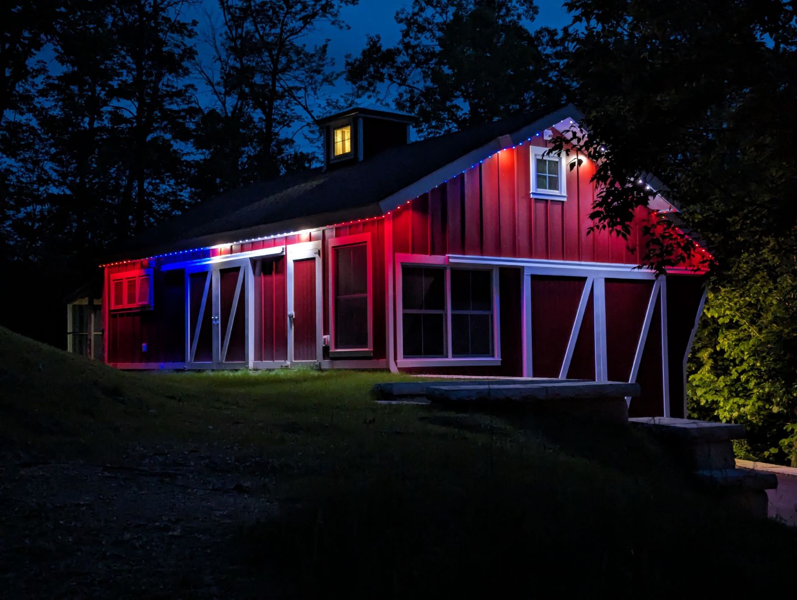 Gemstone patriotic lighting on barn